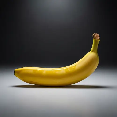 Simplicity in Yellow: Ripe Banana Against Neutral Background