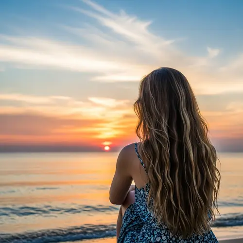 Beautiful Hispanic Girl Watching Sunset on Calm Sea