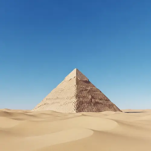 Serenity of Desert: Azure Sky and Pyramid in Golden Light