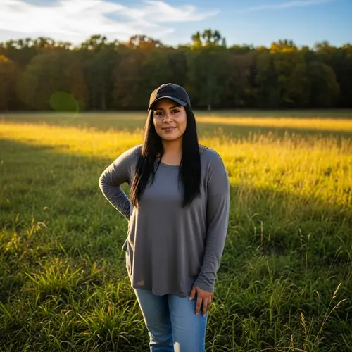 Hispanic Woman Wearing Baseball Cap in Field