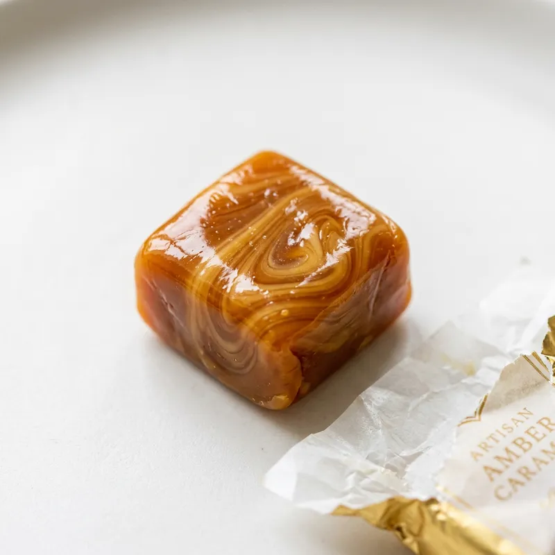 Glossy Caramel Candy - Sweet Swirls on White Backdrop