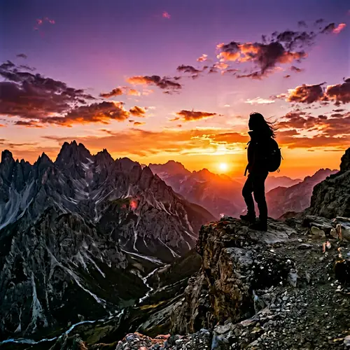 Stunning Mountain Landscape at Sunset with Silhouette of Asian Woman