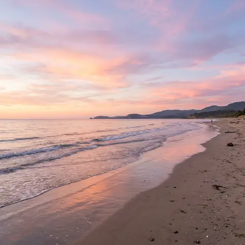 Tranquil Sunset Beach Scene in Pastel Colors