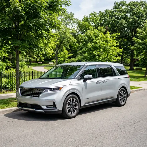 Sleek Silver Kia Carnival Parked on Quiet Street