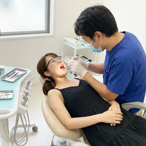 Japanese Girl in Dentist Chair - Dental Treatment Image