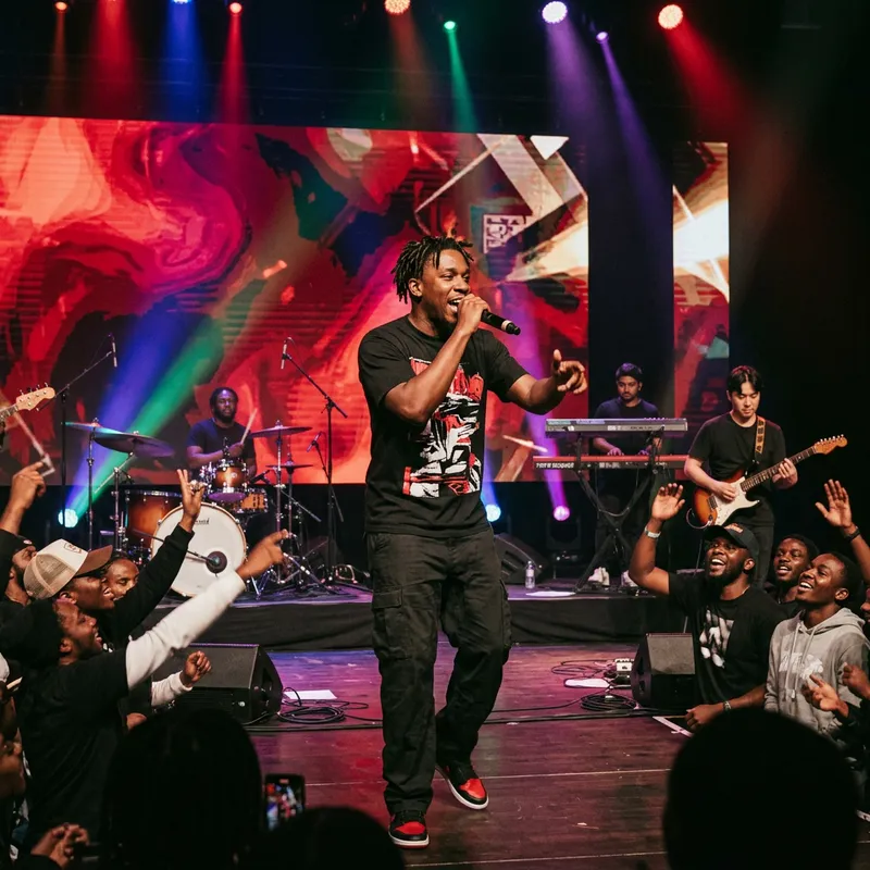 Energetic Rap Show on Dimly Lit Stage | Diverse Music Styles