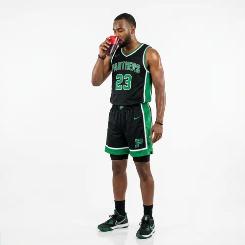 African-American Basketball Player Enjoys Grape Juice