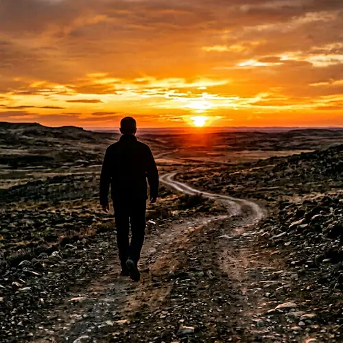 Silhouette Man Walking Away at Sunset