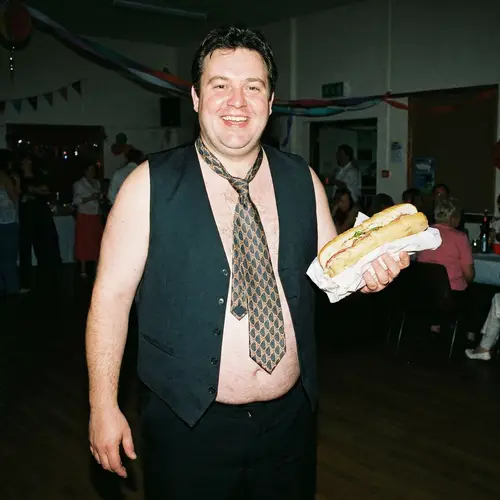 Fat Male Stripper with Submarine Sandwich