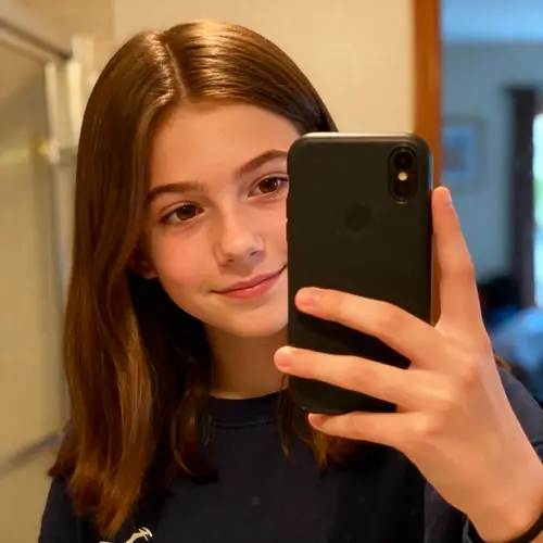 16-Year-Old Girl Taking a Stylish Selfie