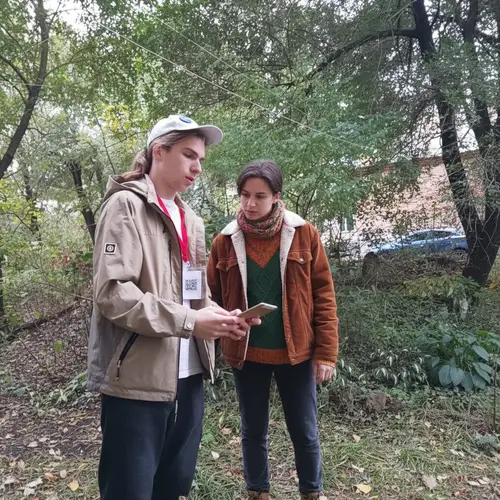 Autumn Fashion: Person Looking at Tablet