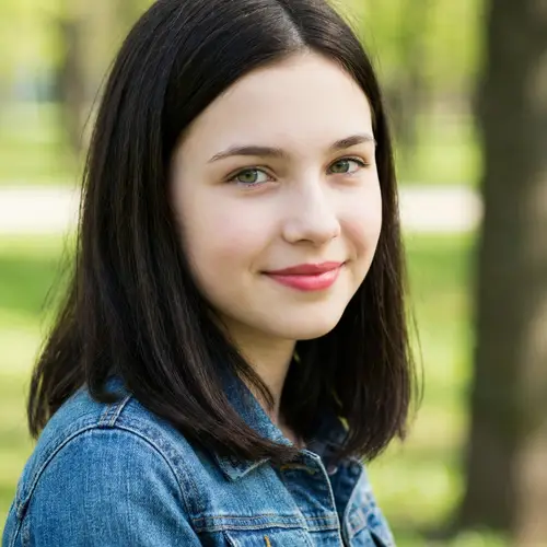 Pretty 15-Year-Old Girl with Black-Brown Hair and Green Eyes