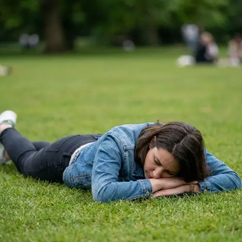 Woman Lying Down with Arms Spread Out