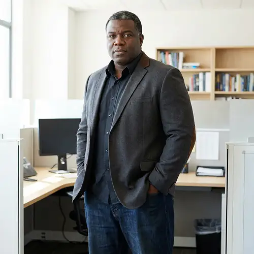 Confidently Dressed Black Man in Office