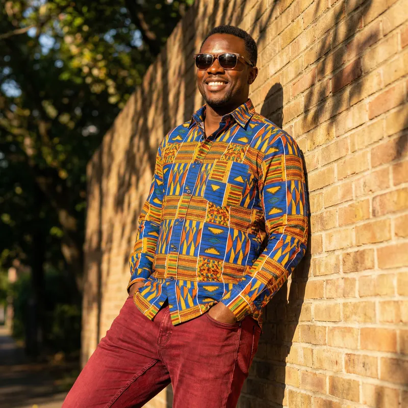 Stylish Black Man in Vibrant Shirt & Red Jeans
