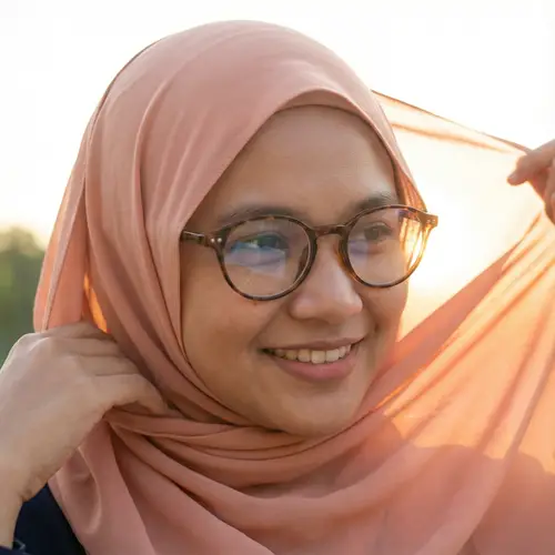 Elegant Malay Woman in Peach Hijab