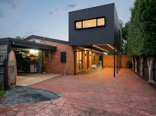 Modern Second-Story Addition to Suburban Red Brick House