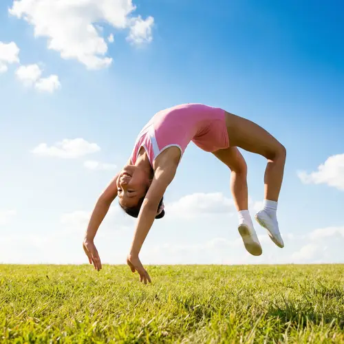 Young Asian Girl Mastering Gymnastics Backflip with Grace