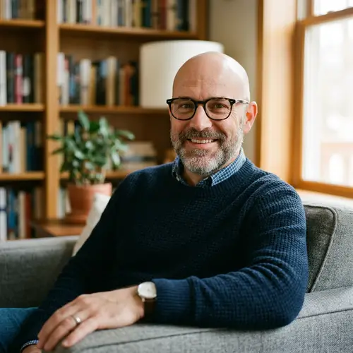 45-Year-Old Man Wearing Glasses and Bald