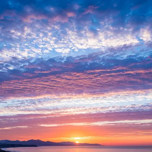 Stunning Sunset Sky with White, Blue, Pink & Orange Clouds