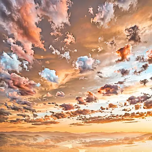Realistic Sunset Sky with White-Orange Clouds