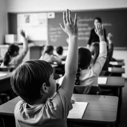 Child Raising Hand in Class - Black and White Photo