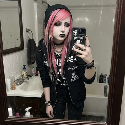 Stylish Emo Girl with Pink Hair and Piercings