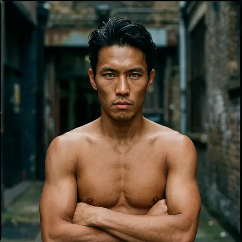 Intense Gaze: Lean Asian Man Portrait