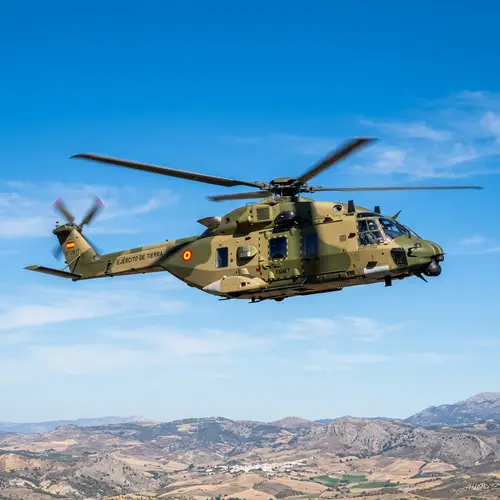 Spain Army Helicopter Flying in Clear Blue Sky