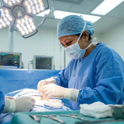 South Asian Female Gynecologist Performing Cesarean Section