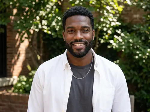 Young Black Man in Open White Shirt