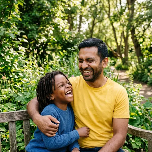 Joyful South Asian Man Laughing with Black Boy Outdoors