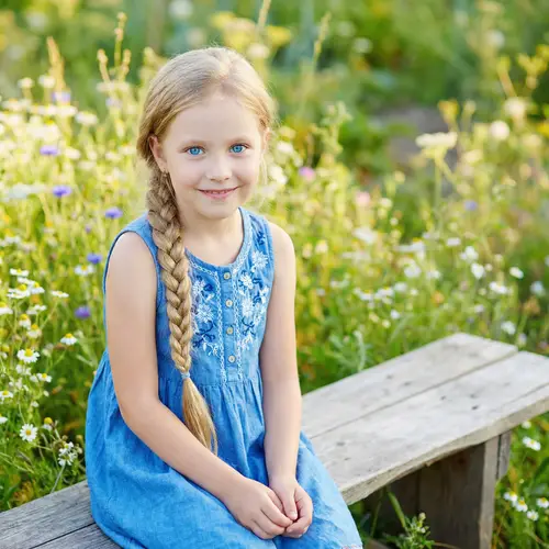 Young Russian Girl in Blue Sundress with Blonde Hair | Website Name