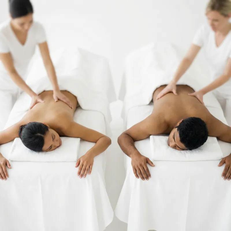 Relaxation Couples Massage Experience on White Background with Blurry High-Angle View