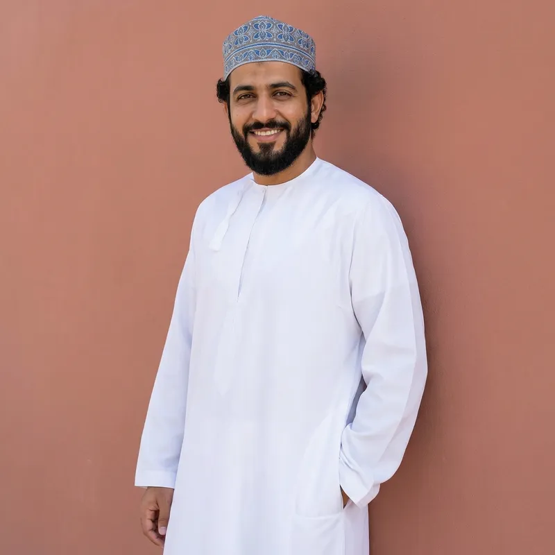 Modern Middle-Eastern Man in Stylish Thawb and Taqiyah