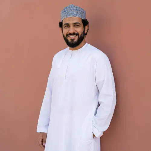 Modern Middle-Eastern Man in Stylish Thawb and Taqiyah