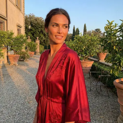 Gorgeous Girl in Red Dress: Sharp Facial Features & Radiant Glow
