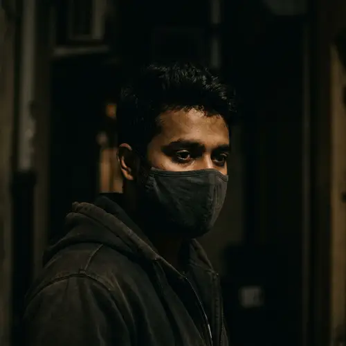 Mysterious South Asian Man Wearing Mask in Dark Silhouette