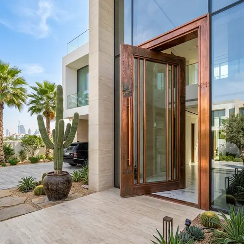 Luxurious Modern Villa Facade with Copper & Glass Pivoting Door in Dubai