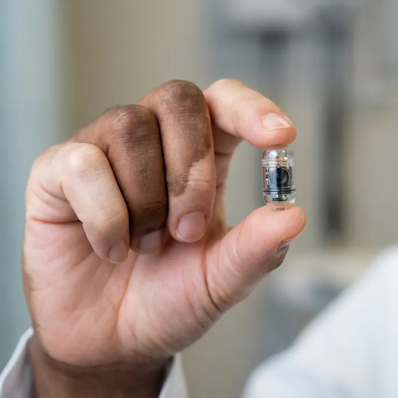 Human Hand Holding Capsule Endoscopy Camera