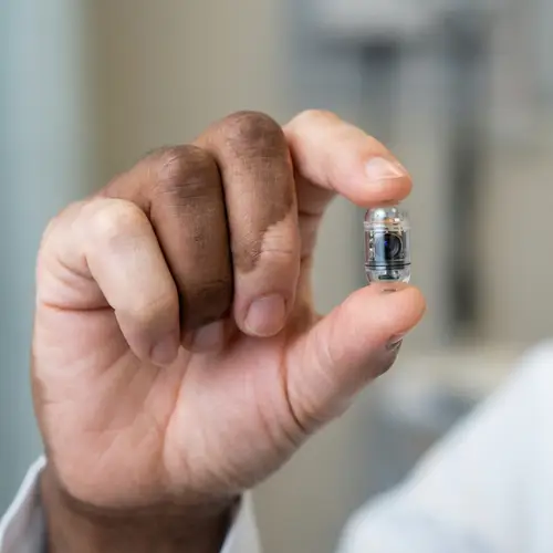 Human Hand Holding Capsule Endoscopy Camera