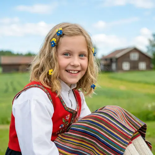 Young Scandinavian Girl in Traditional Folk Costume