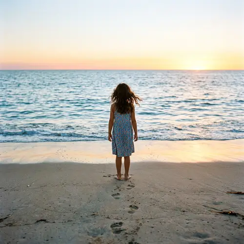 Tranquil Moment at Beach: Young Hispanic Girl Amidst Serene Horizon