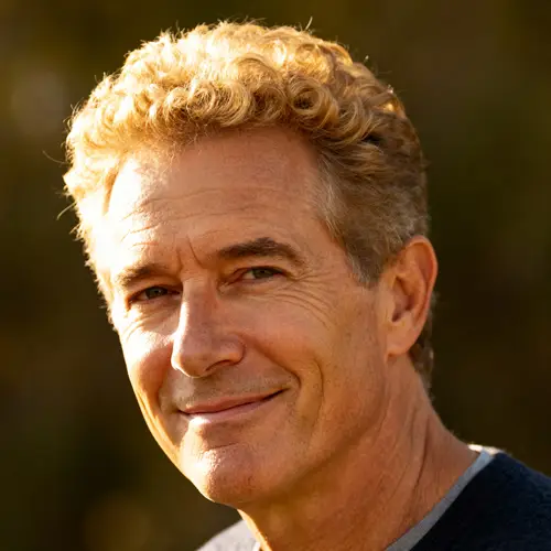 50-Year-Old Man with Short Curly Blond Hair