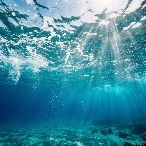 Tranquil Seawater Scene: Vivid Blues & Sunlight Rays