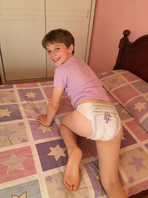 Happy 10-Year-Old Boy Crawling in Diapers
