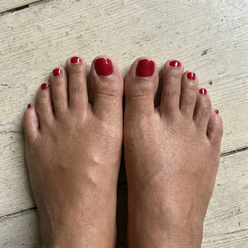Perfectly Proportioned Female Toes in Medium Brown with Red Polish