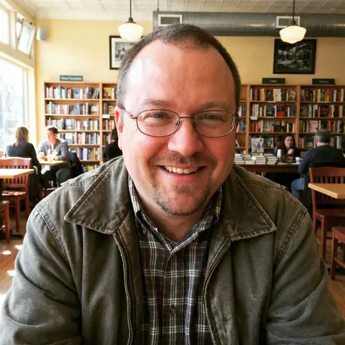 Chubby Man with Goatee & Glasses – A Profile