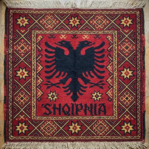 Albanian Flag Symbol on Traditional Rug | SHQIPNIA Text