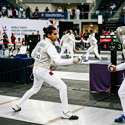 Determined Middle-Eastern Teenage Boy in Intense Fencing Match